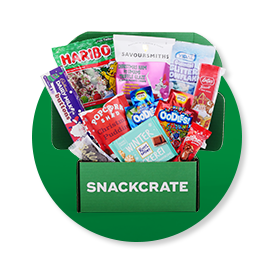 an open green Holiday crate overflowing with snacks on a green background