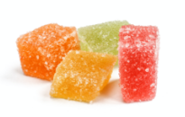 A pile of colorful gummy candy covered in sugar