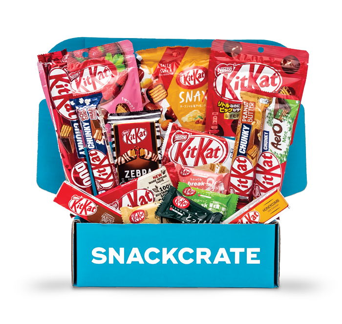 Image of an open Kit Kat collection box overflowing with snacks
