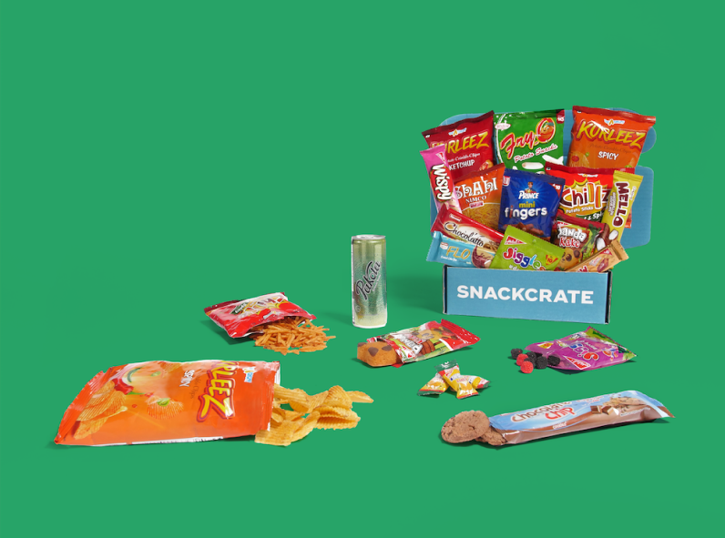 An open Pakistan SnackCrate surrounded by snacks