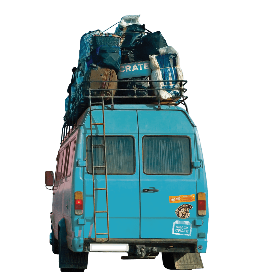 A blue van carrying luggage strapped to its roof including a blue SnackCrate