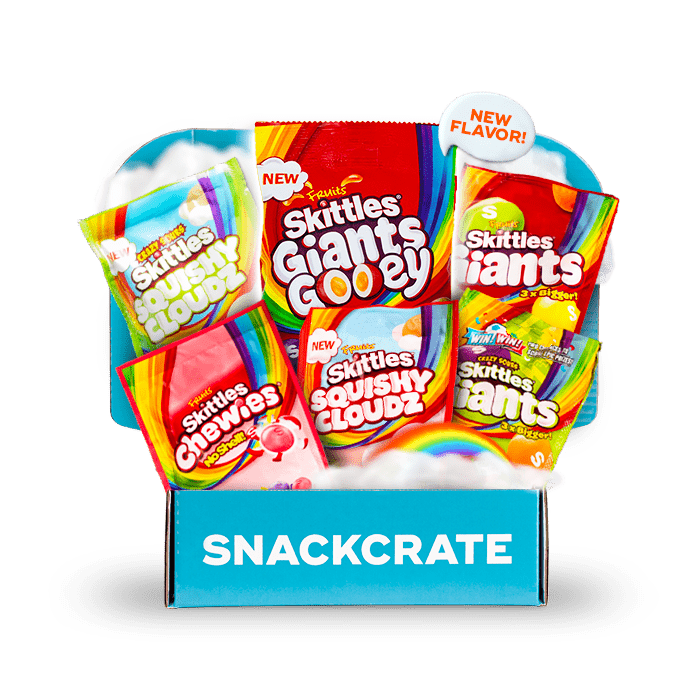 Image of an open British Skittles collection box overflowing with snacks